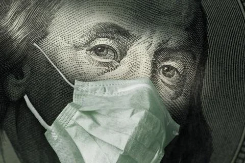 Portrait of Benjamin Franklin 100 dollar Bills with a medical mask from the c Stock Photos