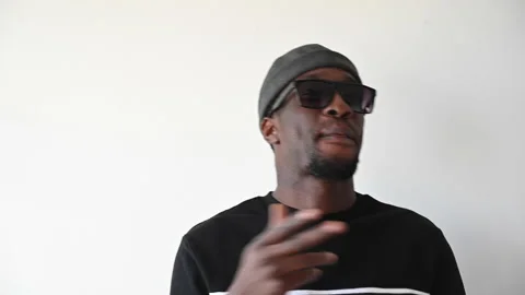 Portrait of black boy having fun on withe background. 스톡 동영상 130454129