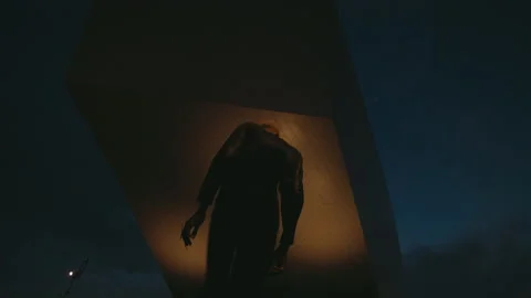 Portrait Of Black Guy Against Background Of Night Sky. Modern Building Behind Vídeos de archivo 212485215