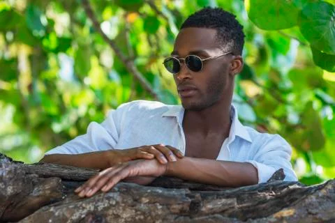 Portrait of black guy in the trees Stock Photos