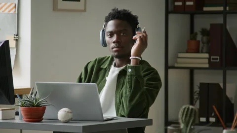 Portrait of Black Male Software Engineer Focusing on Work on Laptop Stock Footage 335936757