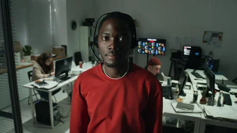 Portrait of Black Man Wearing Headset in Customer Support Center Stock Footage 346713270