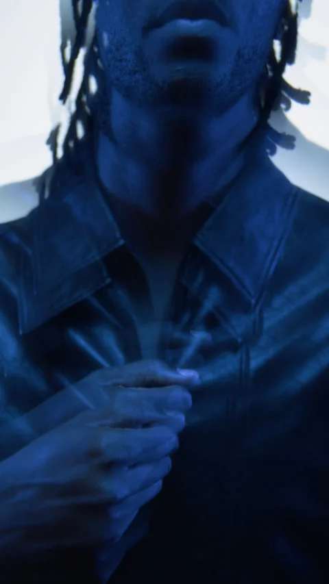 Portrait of Black Man Zipping Jacket in Neon Light for Fashion Video Stock Footage 341394154