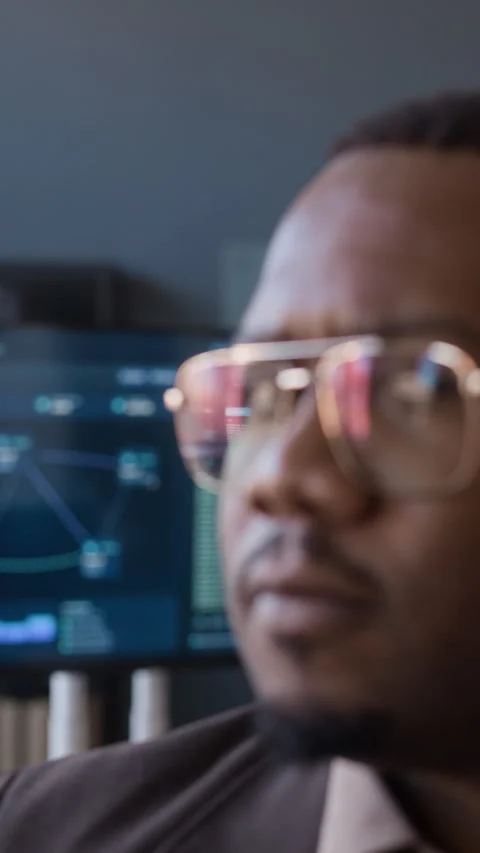 Portrait of Black Network Engineer Working in Office with Codes on Monitor 動画素材 334929764