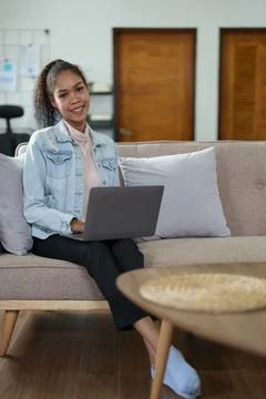Portrait of a black person using a computer at home Stock Photos