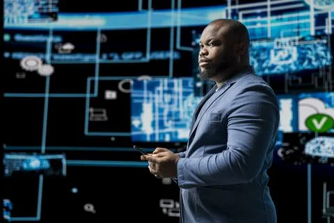 Portrait of a black professional engaged in coding and analytics 스톡 사진