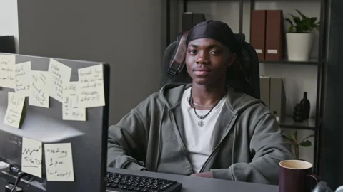 Portrait of Black Programmer Smiling at Computer in Office Stock-Footage 336708808