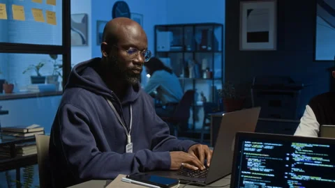 Portrait of Black QA Engineer Testing Software Product in Dimly Lit Office Stock Footage 329616367