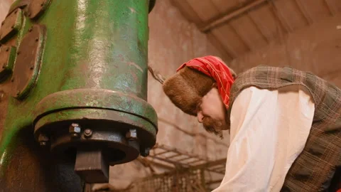 Portrait of a blacksmith on the background of a forge. Stock Footage 103748264