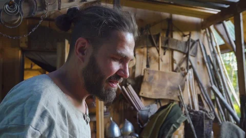 Portrait of blacksmith working with blacksmith furs in forge. Stock Footage 108826075