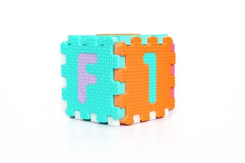 Portrait of block forming a cube with alphabets Stock Photos