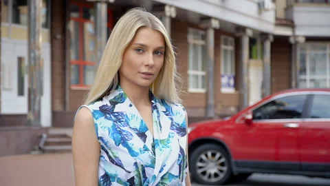 Portrait of a blonde on a background of parking Stock Footage 114795670
