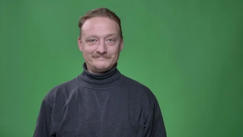 Portrait of blonde middle-aged man with beard watching gladly into camera on Video stock 107634806