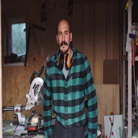 Portrait of a bold worker carpenter with vintage moustache in work clothes in Stock Footage 69541526