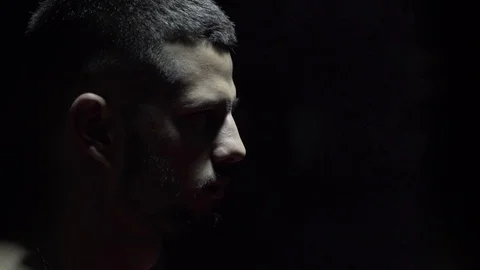 Portrait of boxer face closeup. View the plan from the side. Swaying of bags. In Stock Footage 80861965