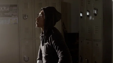 Portrait of boxer sitting on bench looking up 스톡 동영상 104539506