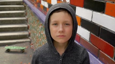 Portrait of a boy against a wall Stock Footage 107440421