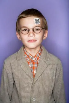Portrait of boy with bar code label on his forehead Stock Photos