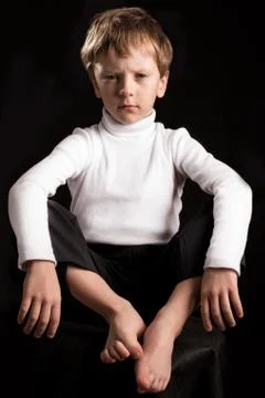 Portrait of the boy on a black background. Stock-Fotos