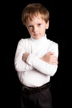 Portrait of the boy on a black background. Stock Photos