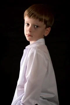 Portrait of the boy on a black background Stock Photos