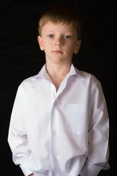 Portrait of the boy on a black background Stock Photos