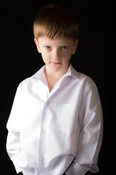 Portrait of the boy on a black background Stock Photos