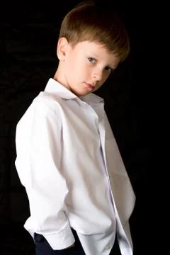 Portrait of the boy on a black background Stock Photos