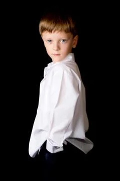 Portrait of the boy on a black background Stock Photos