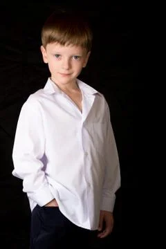 Portrait of the boy on a black background Stock Photos