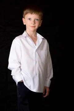 Portrait of the boy on a black background Stock Photos