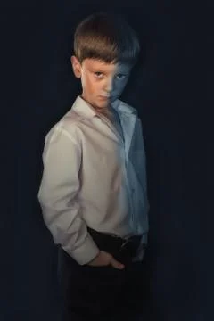 Portrait of a boy on a black background Stock Photos