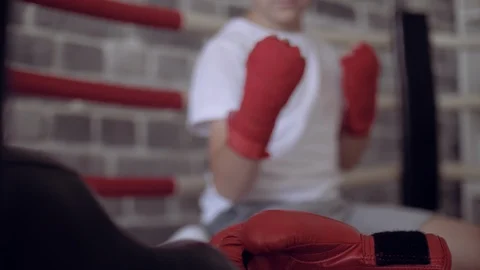 Portrait of boy boxer is wrapped with red bandages his hands. Stock Footage 111550443