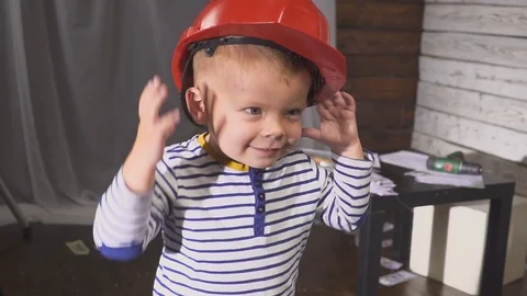 Portrait boy builder in helmet smiling Video stock 97988225
