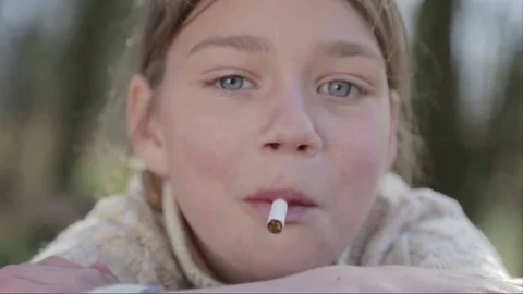 Portrait of a boy with a cigarette in his hand. Anti tobacco video. Stock Footage 75175698