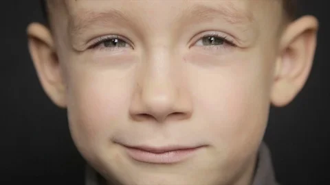 Portrait of a boy close-up on a black background Stock Footage 71732412