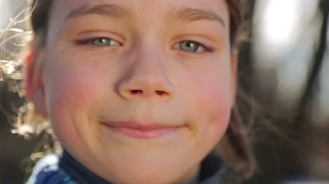 Portrait of a boy close up, open and close the camera. Video stock 60950285