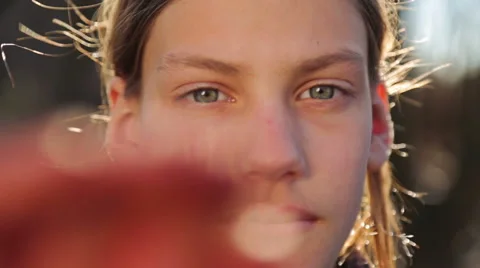Portrait of a boy close-up, open and close the camera. Video stock 60951113