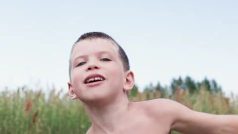 Portrait of boy dancing in front of camera. Video stock 287445671