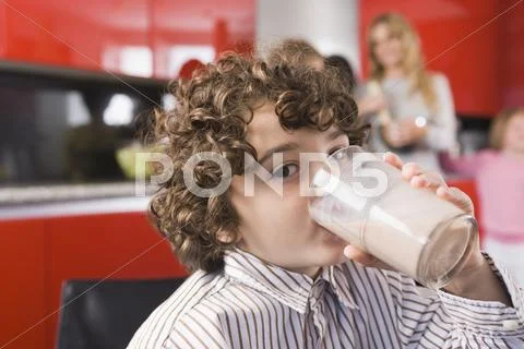 Portrait Of A Boy Drinking A Glass Of Milk