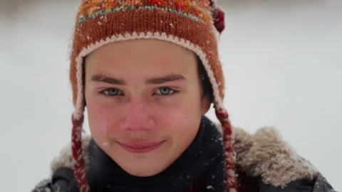 Portrait of boy face close up in snowfall. Stock Footage 101744308