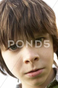 Portrait Of Boy Frowning Stock Photos