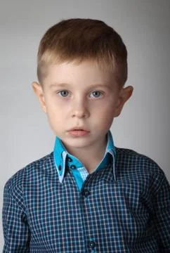 Portrait of a boy on gray background Stock Photos