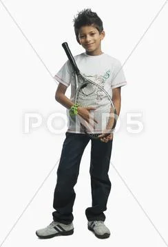 Portrait of a boy holding a tennis racket Stock Photos
