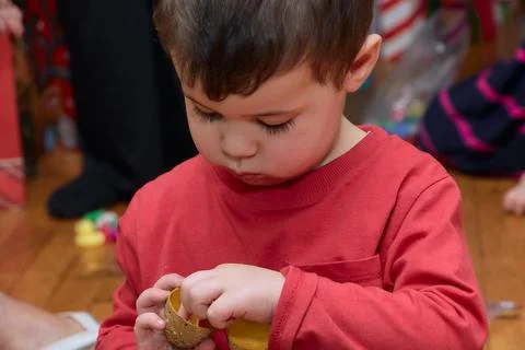 Portrait of a boy with holiday presents in the background Stock Photos