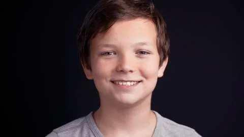 Portrait of boy looking the camera and laughing Stock Photos