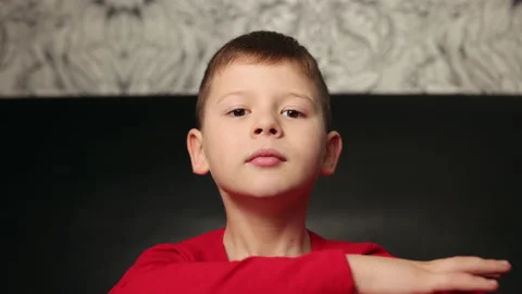 Portrait of boy looking into a camera, smiling. Social distancing and isolation Stock Footage 150661103