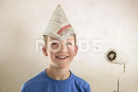 Portrait boy paper hat painting decorating Stock Photos