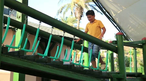 Portrait of the boy  playing at the playground 스톡 동영상 64793738