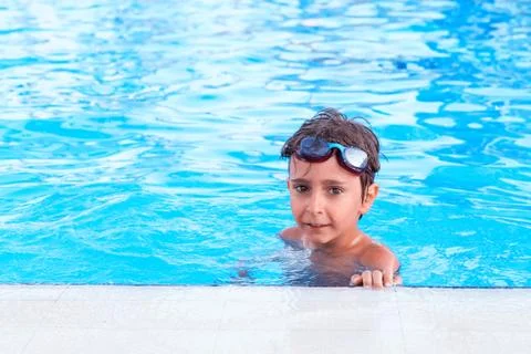 Portrait of the boy in the pool Stock Photos